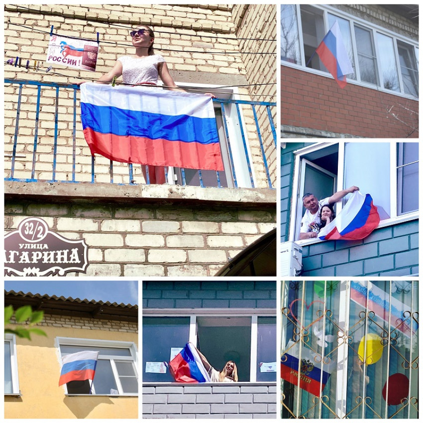 «Котельниково – Земля Героев» флагами в окнах домов поздравила страну с праздником